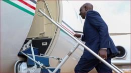President William Ruto boards a plane.
